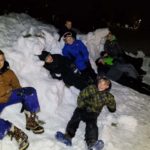 Kids in snow having fun.